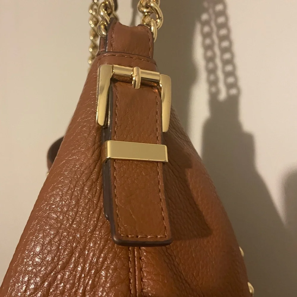 Michael Kors cognac pebbled leather hobo bag w hang tag